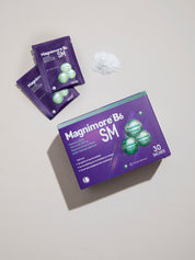 Magnimore B6 SM box with individual sachets and powder displayed on a neutral background